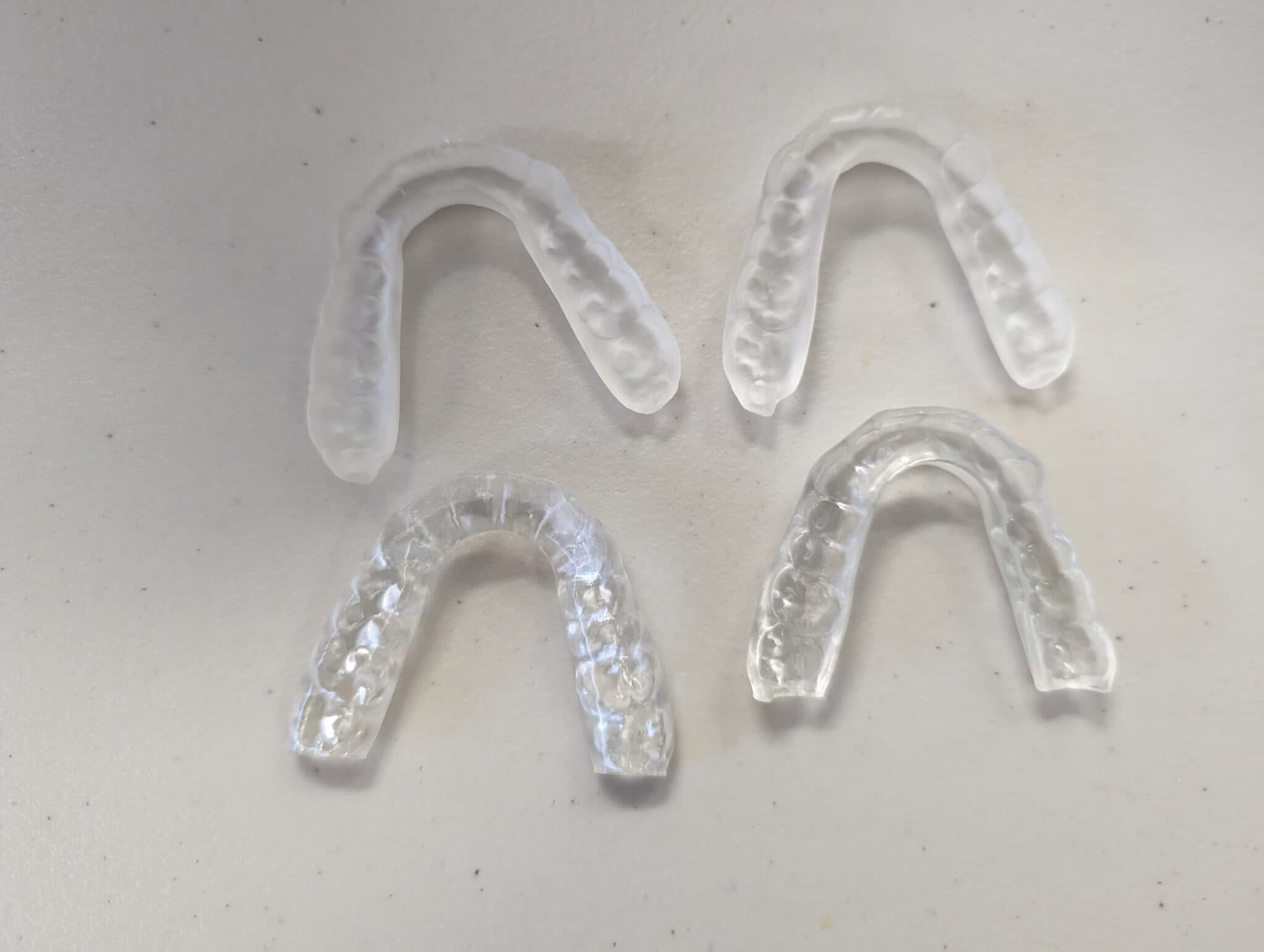 Figure 7: Same splints, same resin, same printer. No post-processing done. Different trays – guess which ones were printed on an UltraGLOSS.