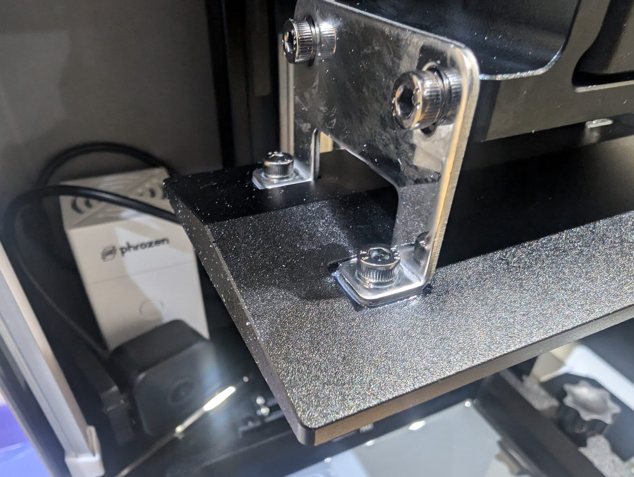 Figure 7: It is impossible to adequately clean resin in the hex screws and around them unless you fully submerge the plate in a wash unit